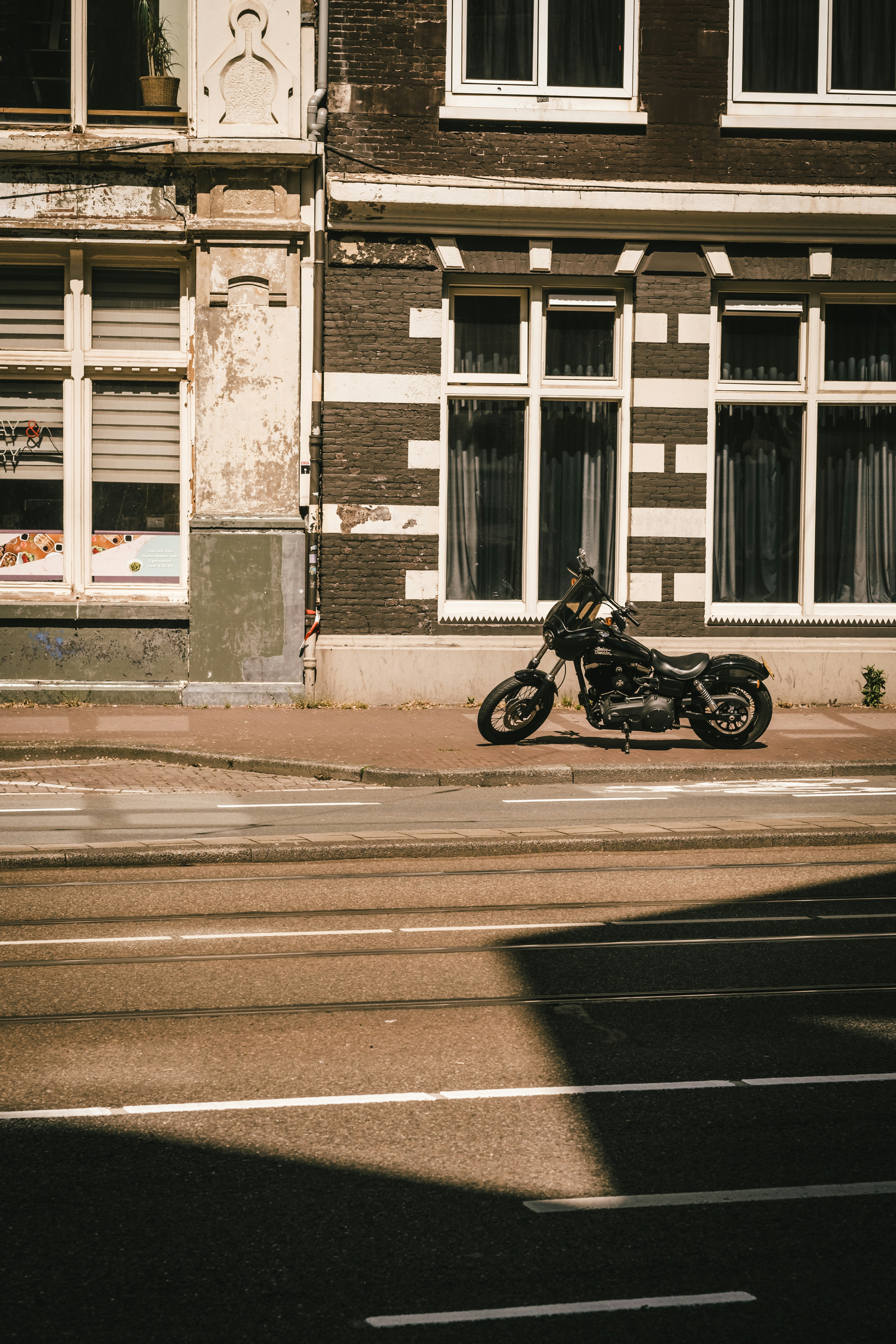 man in black jacket riding motorcycle on road during daytime